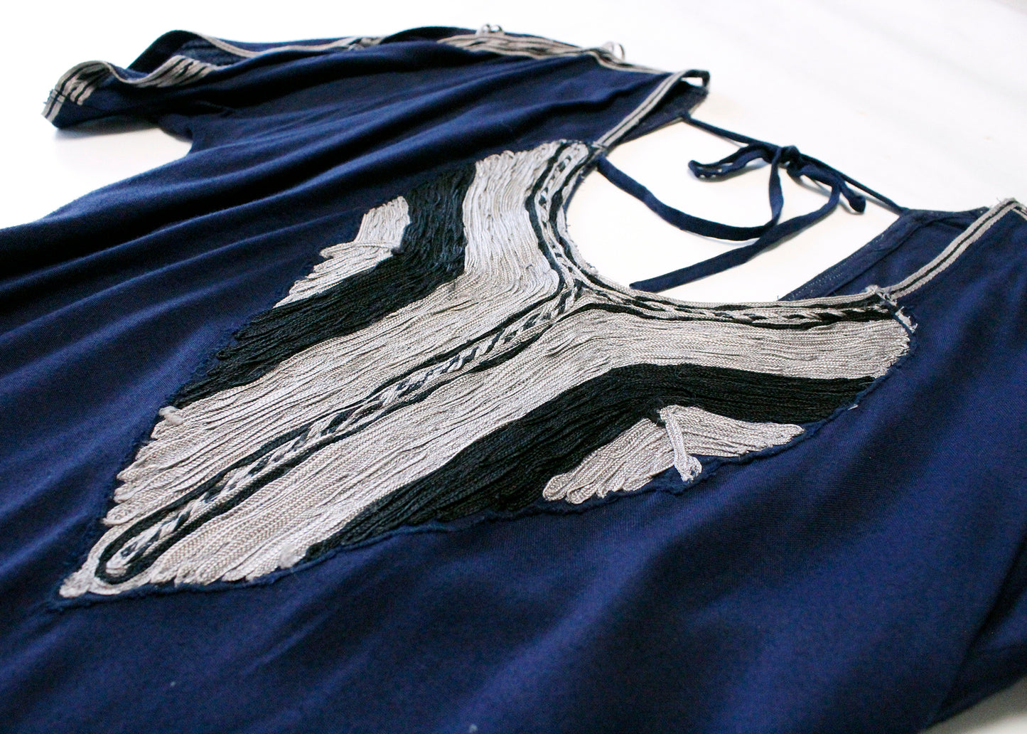 Free People Navy Blue Top with Cutout Shoulders & Silver Appliqué