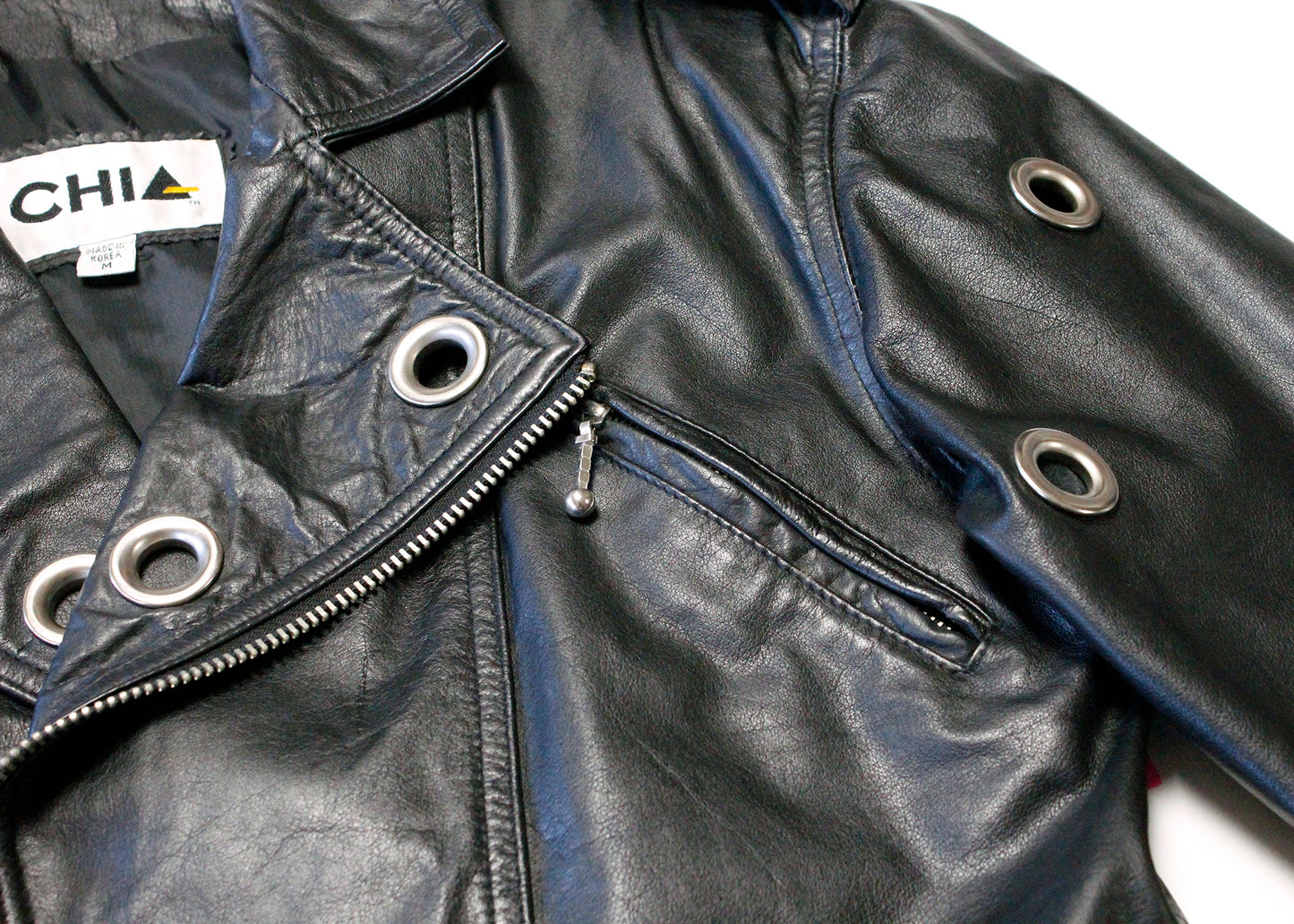 Chia 1980s Black Leather Crop Jacket with Grommeted Sleeves